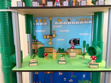 The Shelves Are Decorated With Paper Marios World And Other Items For
