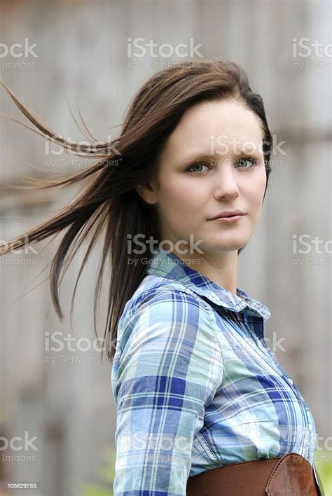 Country Woman With Her Hair Blowing In The Wind Stock Photo Download
