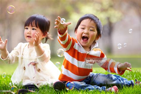 Happy Kids Playing Together Outdoor High-Res Stock Photo ...