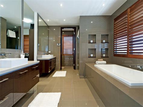 Modern stylish condo bathroom design with gray tiling. Modern bathroom design with recessed bath using ceramic ...