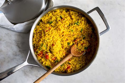 In a medium pot, heat oil on medium and then lightly sauté onions and garlic until translucent and fragrant. Turmeric Rice With Tomatoes Recipe - NYT Cooking