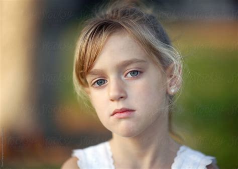 Portrait Of Beautiful Little Girl With Hazel Eyes By Stocksy