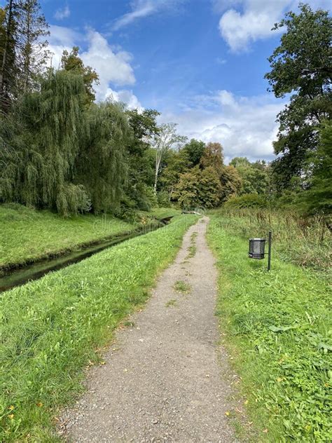 Path In The Park Next To The River With Colorful Autumn Trees Stock