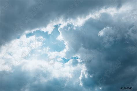 Dark Blue Sky With White Grey Clouds Dramatic View Of Stock Photo