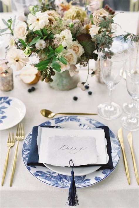 Elegant Blue And White Tablescape With Gold Accents Photo