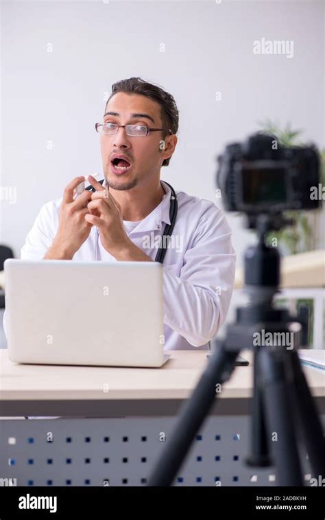 Young Male Doctor Recording Video For His Blog Stock Photo Alamy