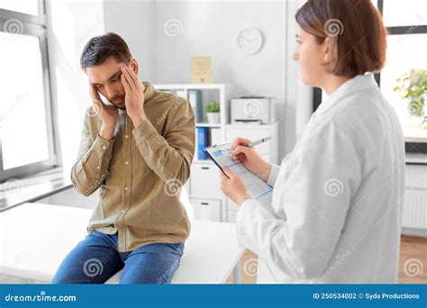 Doctor And Man With Health Problem At Hospital Stock Photo Image Of