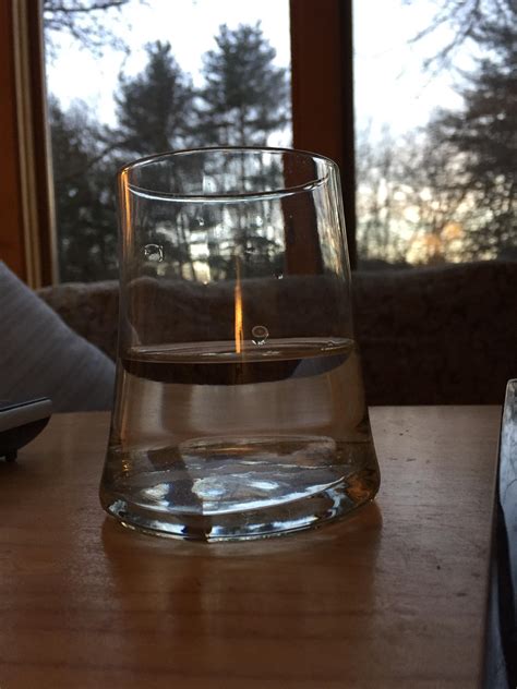 The way the light reflects on this glass of water making it look like a ...