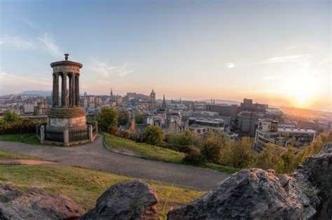 Panorama Of Edinburgh Against Sunset With Calton Hill Stock Photo