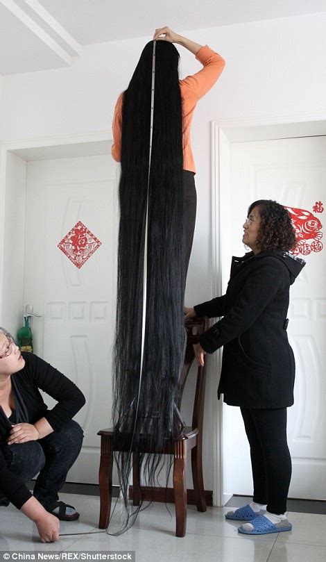 Chinese Woman Showcases Her 11 Foot Long Hair After Saving It For 18