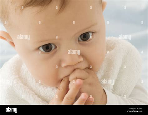 Baby Putting Fingers In Mouth Close Up Stock Photo Alamy