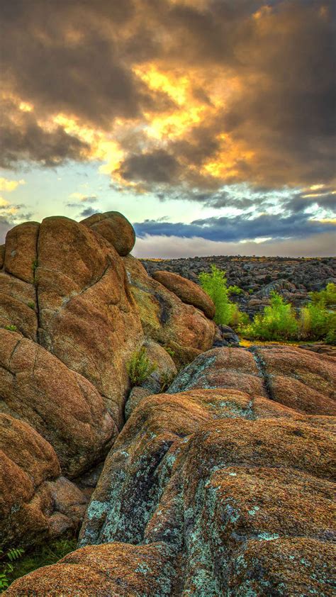 Landscape View Of Stones Rocks Mountains River Under Black Clouds Blue