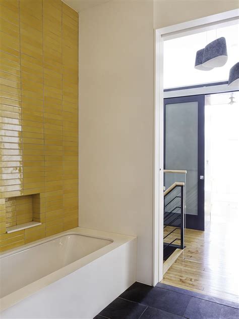 Are you after bathroom tile ideas? A kids' bath wrapped in tile in Brooklyn | Yellow bathroom ...