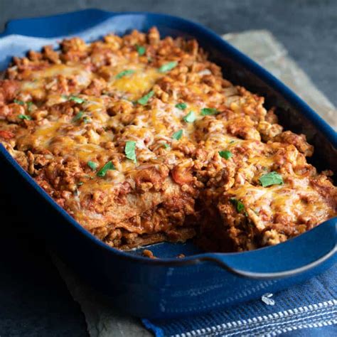 Learn how to make chicken enchilada casserole. layered chicken enchilada casserole - Healthy Seasonal Recipes