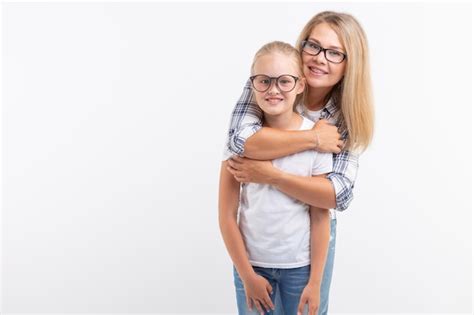 Premium Photo Portrait Of Mother And Daughter With Eyeglasses On White Background