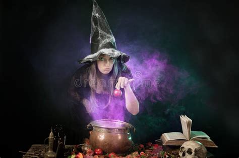 Halloween Witch Cooking A Potion In A Cauldron Stock Image Image Of