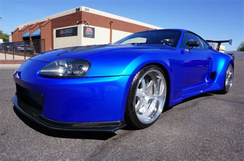 Old supra trying to keeping up with new ones. 1994 Supra Twin Turbo Widebody Magazine Cover Car like ...