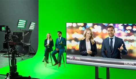Top view of green screen tablet on design table with team discussion. Motorsport Network Creates Green Screen Studios With ...
