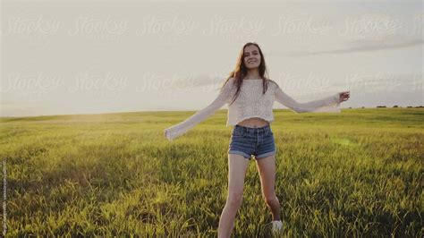 Skinny Young Woman Spinning In Field By Stocksy Contributor Sergey Narevskih Stocksy