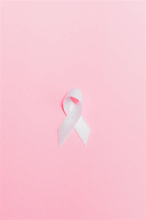 Pink Ribbon On Pink Surface · Free Stock Photo