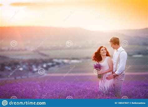 Romantic Couple In An Endless Lavender Field At Sunset Blond Man And