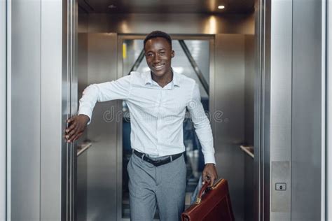 Black Businessman Goes Into The Elevator In Office Stock Photo Image