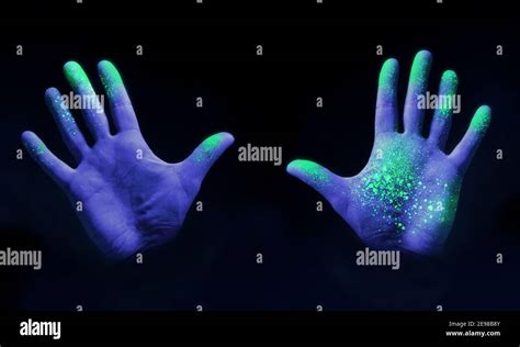 Human Hands Glowing From Uv Ultra Violet Light Showing Bacteria And