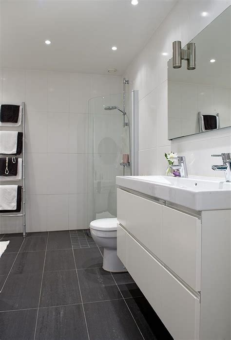 Gray and blue tile bathroom interior, tub and sink. Bathroom tiles | Bathroom layout, Minimalist bathroom ...