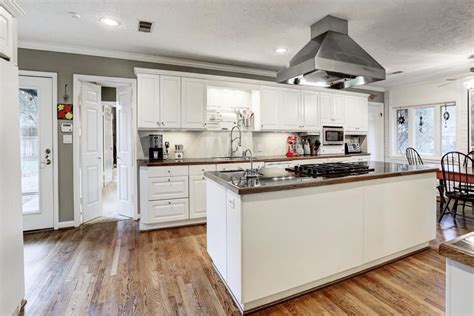A large kitchen island without a sink or cooktop built in provides tons of extra counter space, making it easy to do all of the above and more. 8626 Ferris Dr. Gourmet kitchen features expansive center ...