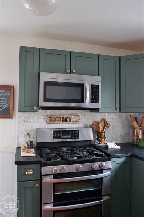 Are you planning to renovate your kitchen countertops? kitchen with green cabinets, soapstone counters, and ...