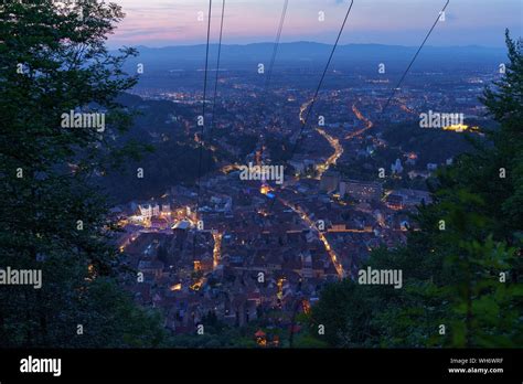 Night View Over Brasov Under The Last Lights Of The Sunset Stock Photo