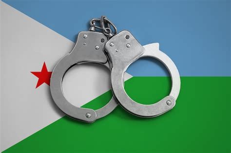 Premium Photo Djibouti Flag And Police Handcuffs The Concept Of Observance Of The Law In The