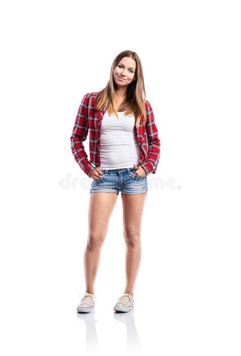 Girl In Shorts And Checked Shirt Arms Crossed Isolated Stock Photo