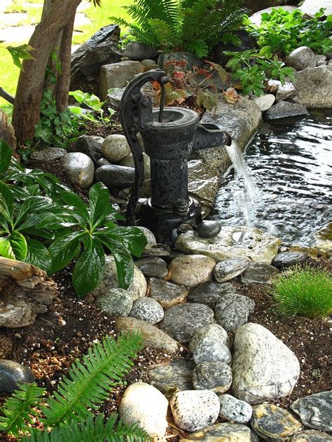 Pond water that you would ordinarily hit with algae shock get diverted to the lawn. 30+ Creative Pond and Fountain Ideas - gardenmagz.com