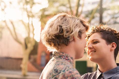 Affectionate Young Lesbian Couple Sharing A Loving Moment Together Outside Stock Image Image