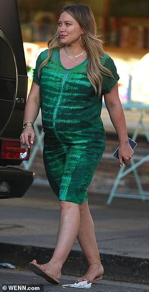 Hilary Duff Displays Her Baby Bump In Loose Fitted Green Dress In La
