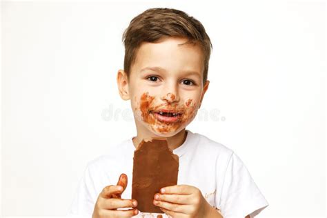 Little Messy Boy Is Eating Chocolate Studio Shot Stock Photo Image Of