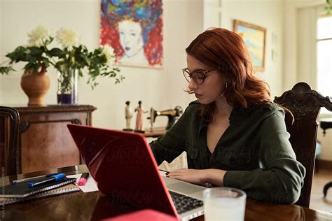 Beautiful Red Haired Teacher In Glasses Working In Study By Guille