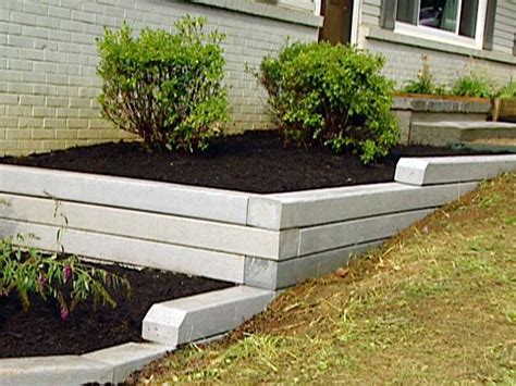 Building a strong retaining wall needs strong products. How to Install a Timber Retaining Wall | HGTV