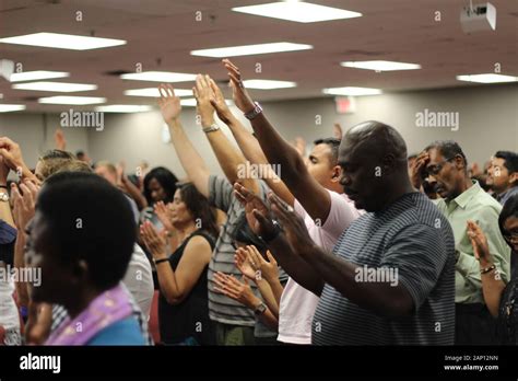 Church Congregation Lifting Hands In Praise And Worship And Prayer