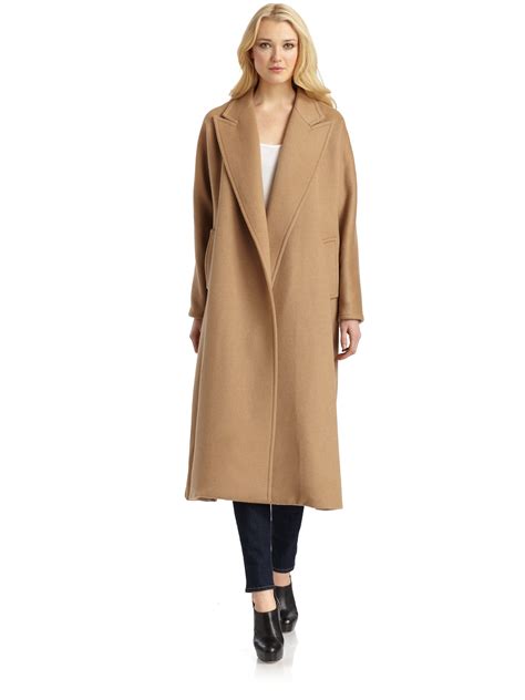 This trench coat has two front pockets and a fake belt detail in the back. Max Mara Prato Camel Hair Coat in Brown - Lyst