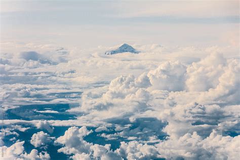 Clouds And Mountain Peak Over Clouds Aerial View Of Sky By Stocksy