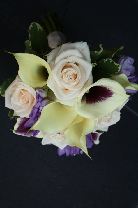 Bridesmaids Bouquet Consisting Of Picasso Calla Lilies And Roses