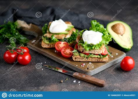 Delicious Sandwich With Avocado And Poached Egg Stock Image Image Of