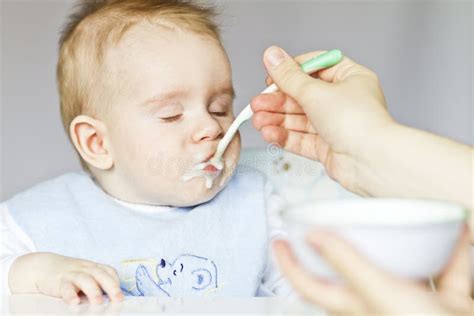 Hungry Baby Eating Porridge Stock Photo Image Of Appetite Childhood