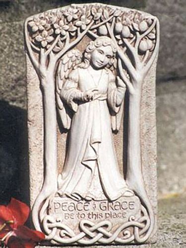 A White Plaque With An Image Of A Woman And Trees