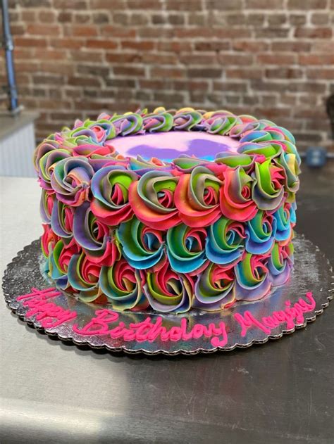 A Birthday Cake With Colorful Swirls On It