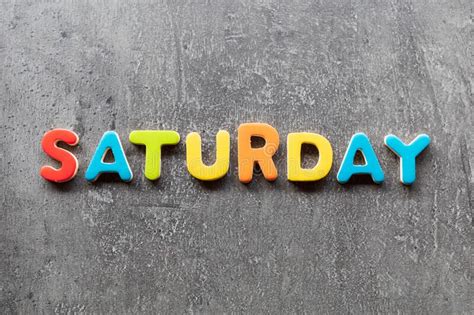 Saturday Word Written With Colorful Letters On Granite Stone Background