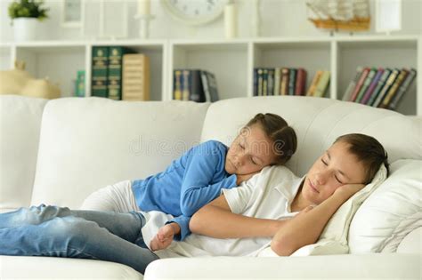 Portrait Of Sleeping Brother Sister And Father In Room Stock Image