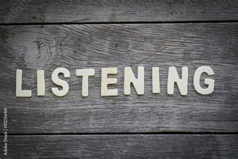The Word Listening On The Wooden Floor Buy This Stock Photo And